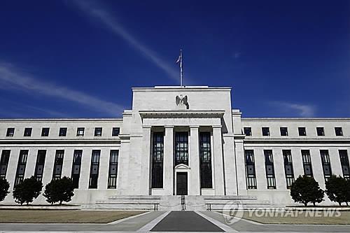 (2nd LD) U.S. Fed holds key lending rate steady, but hints at another hike later this year