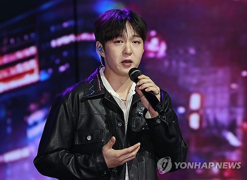 BTOB's Lee Chang-sub sings "Old Town," one of the two lead tracks of his first full-length album, "1991," during a media showcase in Seoul on Oct. 2, 2024. (Yonhap)