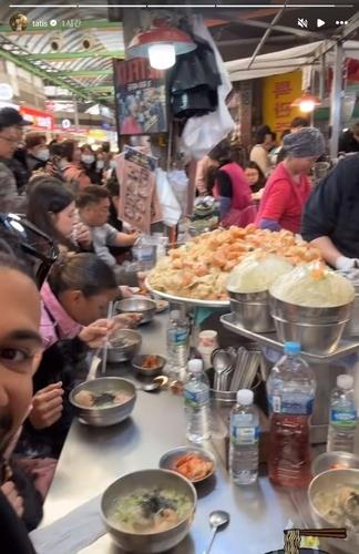 Fernando Tatis Jr. eating dumplings at Gwangjang Market