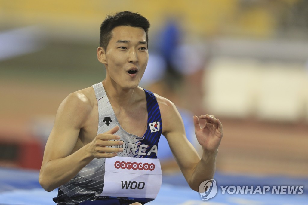 In this Assoicated Press photo, Woo Sang-hyeok of South Korea celebrates after a successful attempt during the men's high jump event at the World Athletics Diamond League competition at Khalifa International Stadium in Doha on May 13, 2022. (Yonhap)