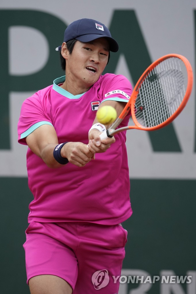 In this Associated Press photo, Kwon Soon-woo of South Korea hits a shot against Andrey Rublev of Russia during their men's singles first-round match of the French Open at Roland-Garros in Paris on May 24, 2022. (Yonhap)