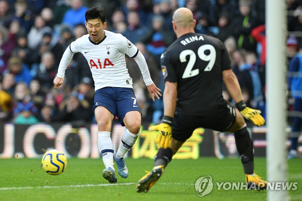 In this AFP photo, Son Heung-min of Tottenham Hotspur (L) scores past Aston Villa's Pepe Reina in a Premier League match at Villa Park in Birmingham, England, on Feb. 16, 2020. (Yonhap)