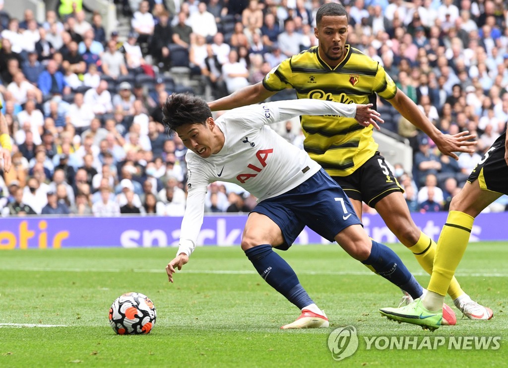 In this EPA photo, Son Heung-min of Tottenham Hotspur (L) is in action against William Troost-Ekong of Watford (R) during the clubs' Premier League match at Tottenham Hotspur Stadium in London on Aug. 29, 2021. (Yonhap)