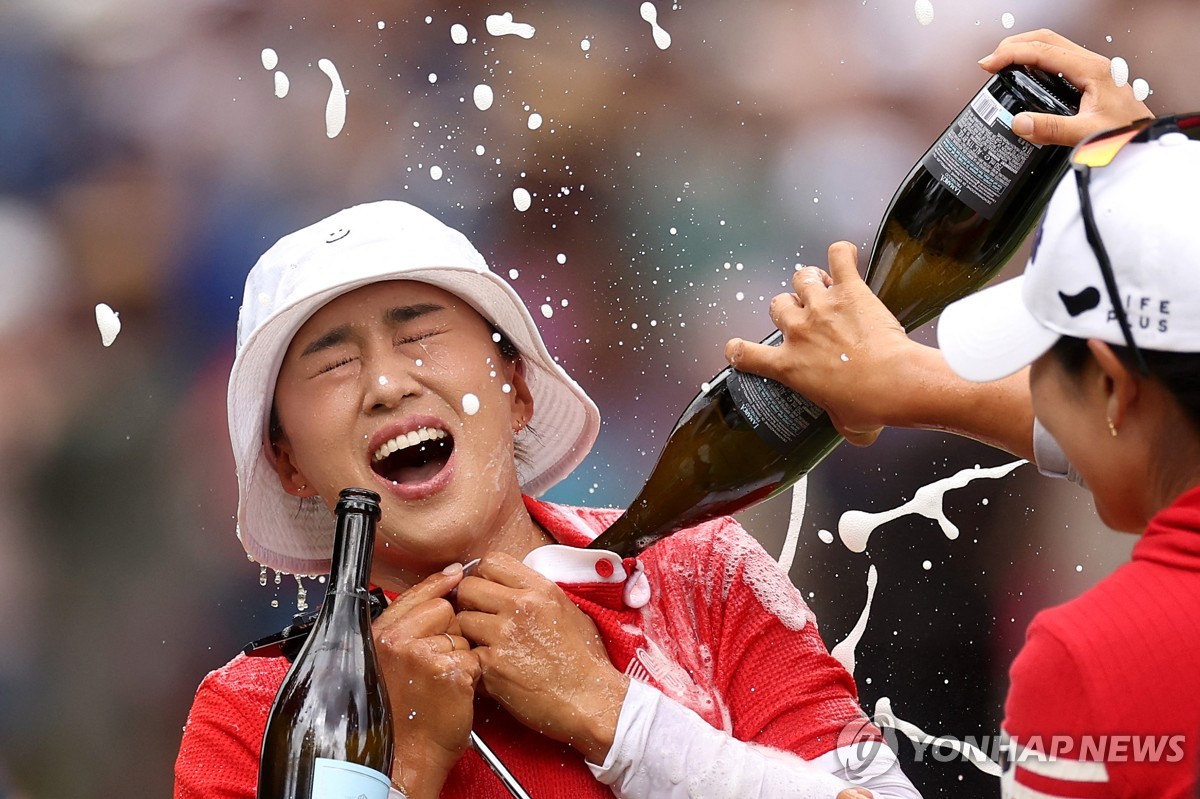 In this Getty Images photo, Amy Yang of South Korea is doused with champagne after winning the KPMG Women's PGA Championship at Sahalee Country Club in Sammamish, Washington, on June 23, 2024. (Yonhap)