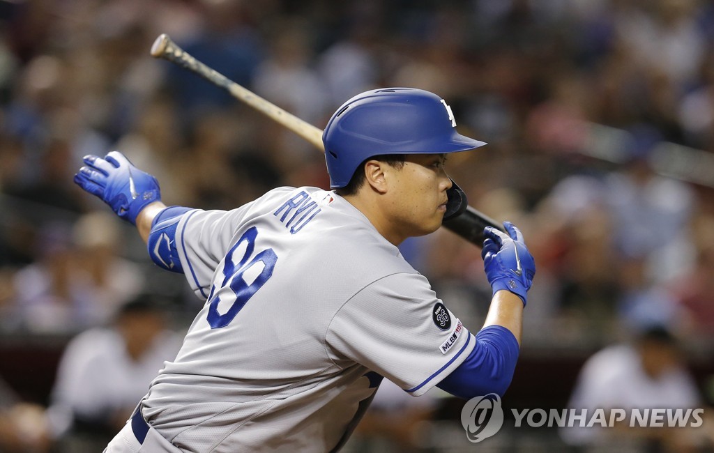 In this Reuters photo via USA Today Sports, Ryu Hyun-jin of the Los Angeles Dodgers hits a single against the Arizona Diamondbacks in the top of the fourth inning of a Major League Baseball regular season game at Chase Field in Phoenix on June 4, 2019. (Yonhap)