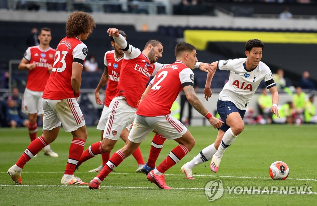In this Reuters photo, Son Heung-min of Tottenham Hotspur (R) is in action against Arsenal in the clubs' Premier League match at Tottenham Hotspur Stadium in London on July 12, 2020. (Yonhap)