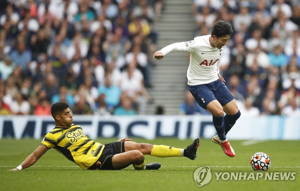 In this Action Images photo via Reuters, Son Heung-min of Tottenham Hotspur (R) tries to avoid a tackle by Adam Masina of Watford during the clubs' Premier League match at Tottenham Hotspur Stadium in London on Aug. 29, 2021. (Yonhap)