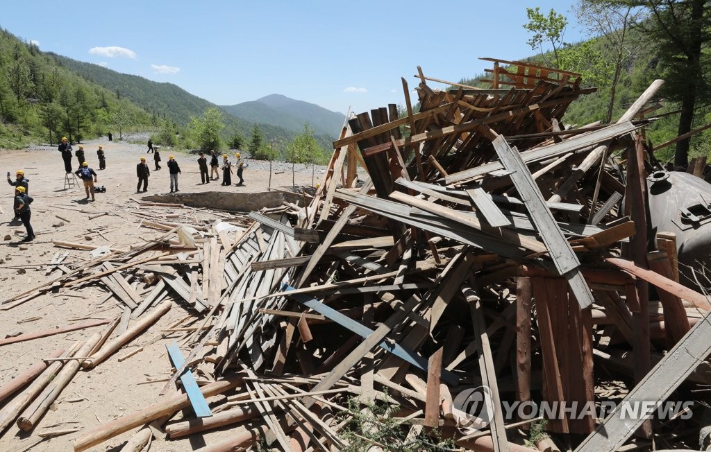 This pool photo, taken May 24, 2018, shows debris piled up on the ground after Tunnel No. 2 of North Korea's only known nuclear test site in Punggye-ri is blown up. The test site was dismantled in a series of explosions over several hours on the day with press members from South Korea, China, Russia, the United States and Britain covering the process. (Yonhap)