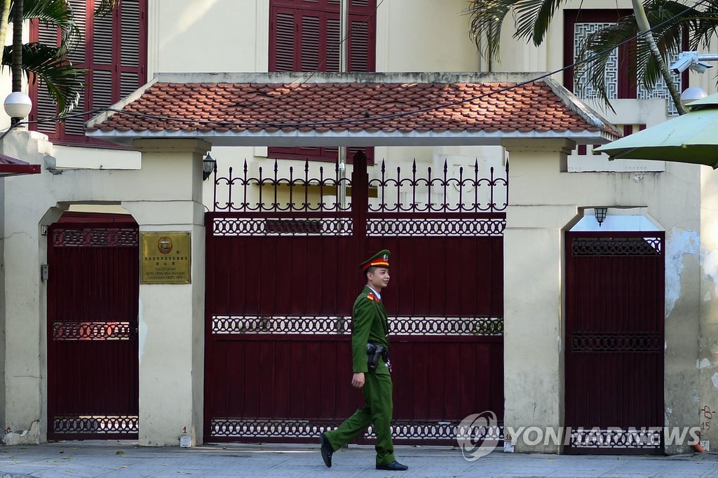 In this AFP photo taken on Feb. 6, 2019, a Vietnamese policeman patrols outside the North Korean embassy in Hanoi. (Yonhap)