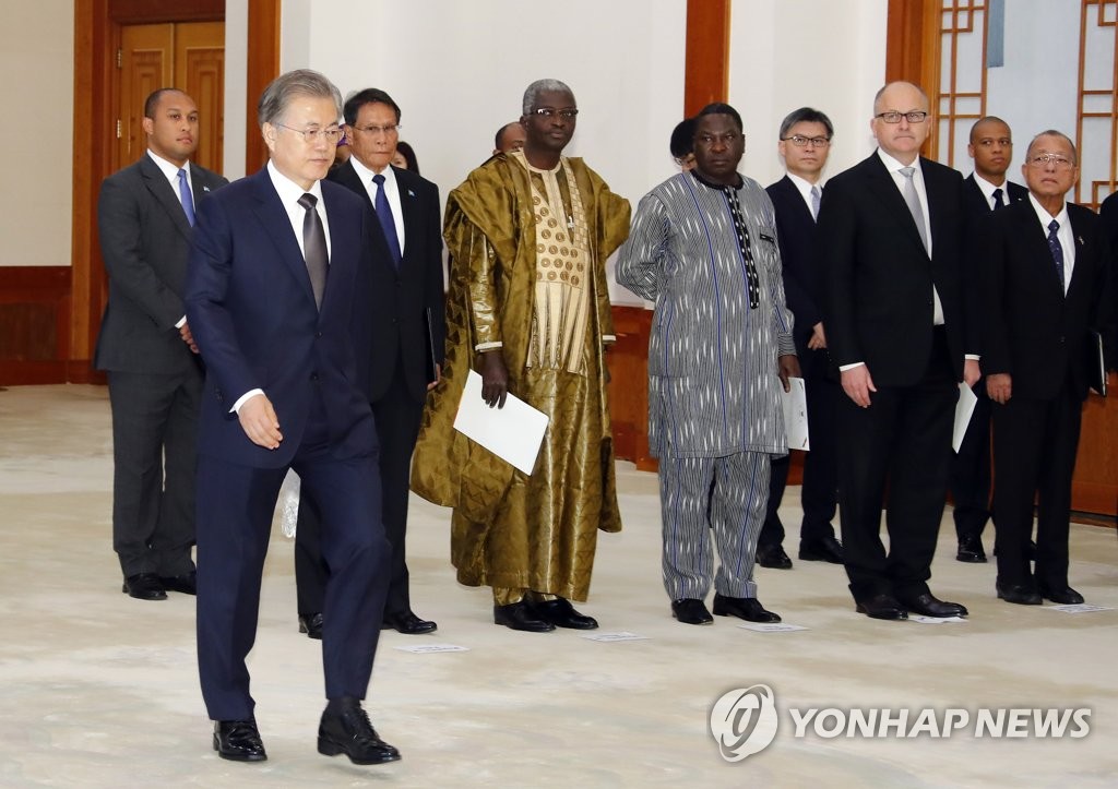 President Moon Jae-in (L, front) attends a ceremony to receive the credentials of new foreign ambassadors to South Korea at the presidential office Cheong Wa Dae on May 3, 2019. (Yonhap)