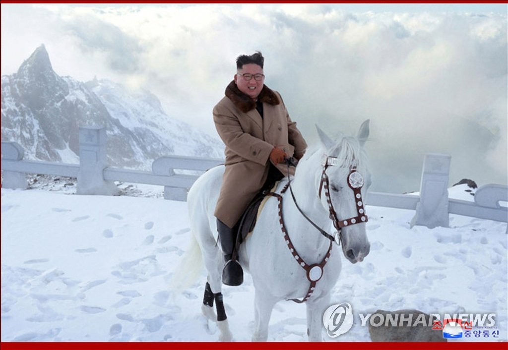 This photo, released by the Korean Central News Agency on Oct. 16, 2019, shows North Korean leader Kim Jong-un riding a white horse up a snow-covered Mount Paektu, the country's highest peak on the border with China, after inspecting construction sites at the foot of the mountain. (For Use Only in the Republic of Korea. No Redistribution) (Yonhap)