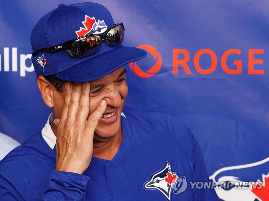 The Toronto Blue Jays' manager Charlie Montoyo smiles during his media availability outside the clubhouse at TD Ballpark in Dunedin, Florida, on Feb. 13, 2020. (Yonhap)