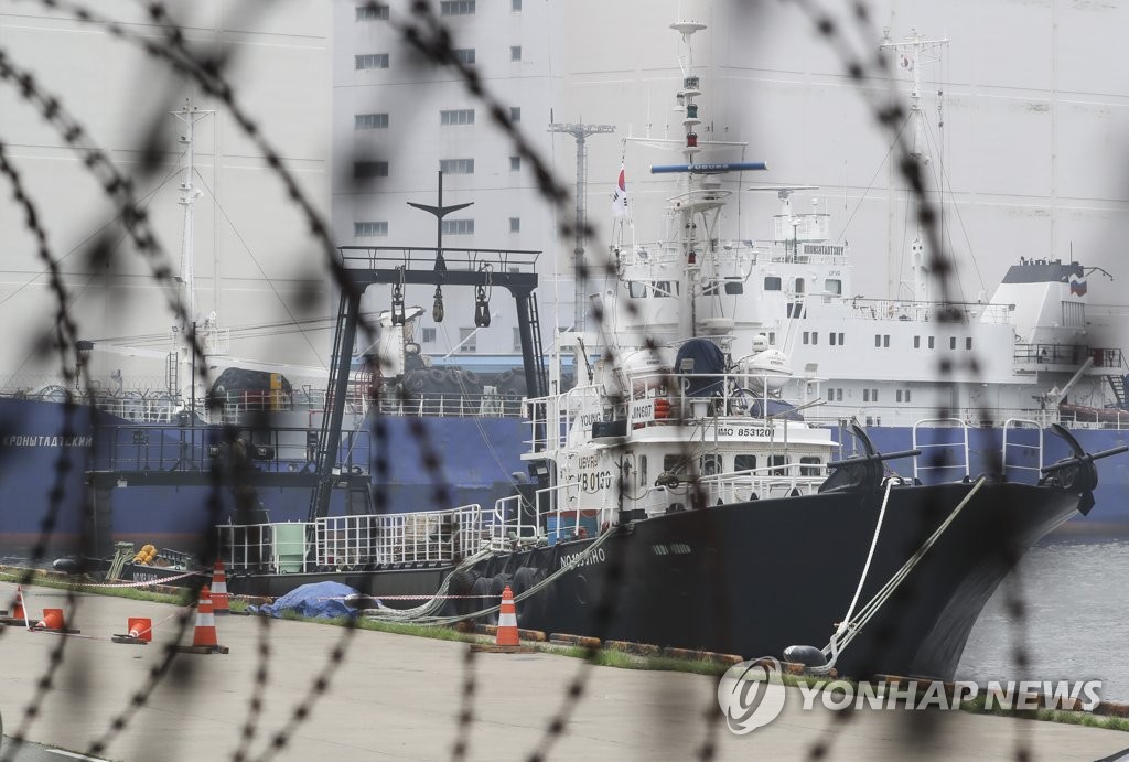 This photo, taken on Aug. 6, 2020, shows the Russia-flagged Young Jin 607 fishing vessel docked at a port in Busan. Health authorities have confirmed eight cases of COVID-19 tied to the ship. (Yonhap)