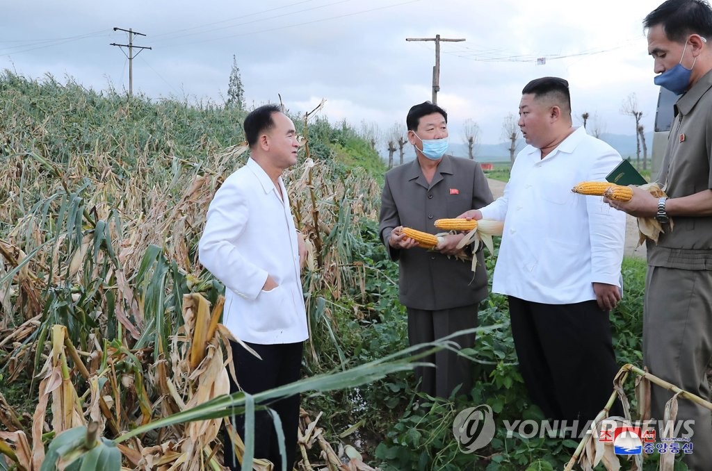 North Korean leader Kim Jong-un (2nd from R) inspects an area damaged by Typhoon Bavi in South Hwanghae Province, in this photo released by the Korean Central News Agency on Aug. 28, 2020. (For Use Only in the Republic of Korea. No Redistribution) (Yonhap)