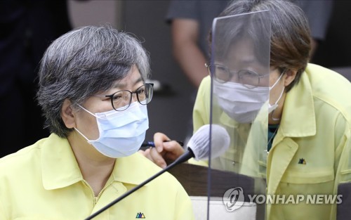 Jeong Eun-kyeong (L), director of the Korea Centers for Disease Control and Prevention (KCDC), attends a government meeting on the country&apos;s response to the new coronavirus at the government complex building in the administrative city of Sejong on Sept. 2, 2020. (Yonhap)