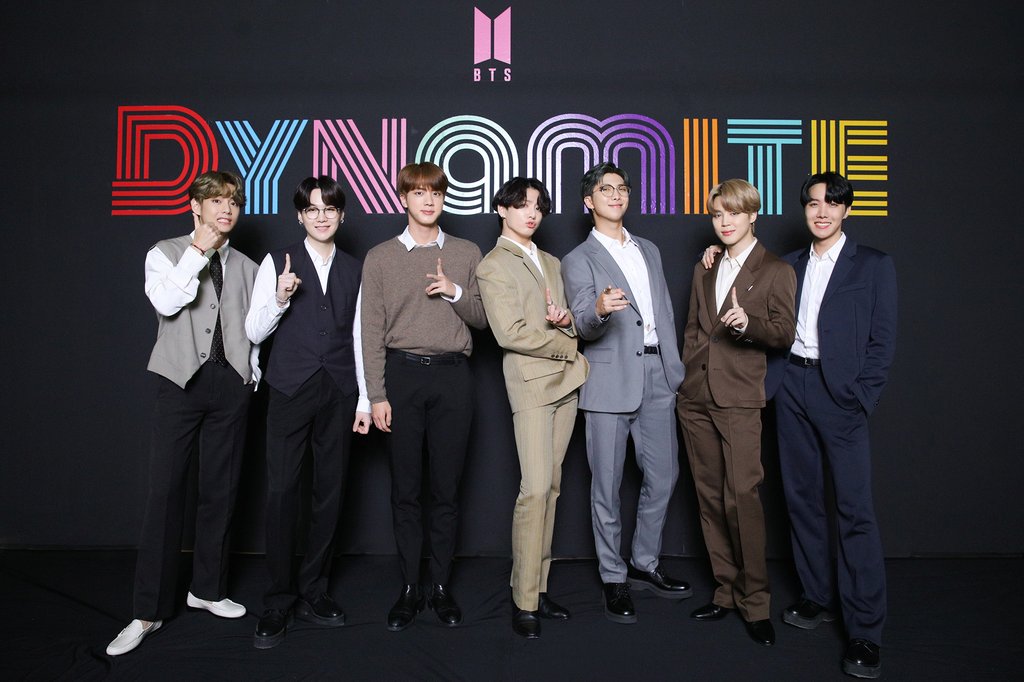 This photo, provided by Big Hit Music, shows the members of BTS posing for photos during an online media day event in Seoul on Sept. 2, 2020. The band's "Dynamite" topped Billboard's main Hot 100 singles chart in the United States on Aug. 31. (PHOTO NOT FOR SALE) (Yonhap)