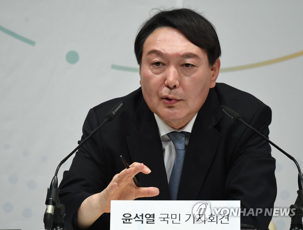 In this file photo, former Prosecutor General Yoon Seok-youl responds to reporters' questions during a press conference at the memorial hall for Yun Bong-gil, a national independence fighter, in Seoul on June 29, 2021, to declare his intention to run in the March 2022 presidential election. (Pool photo) (Yonhap)