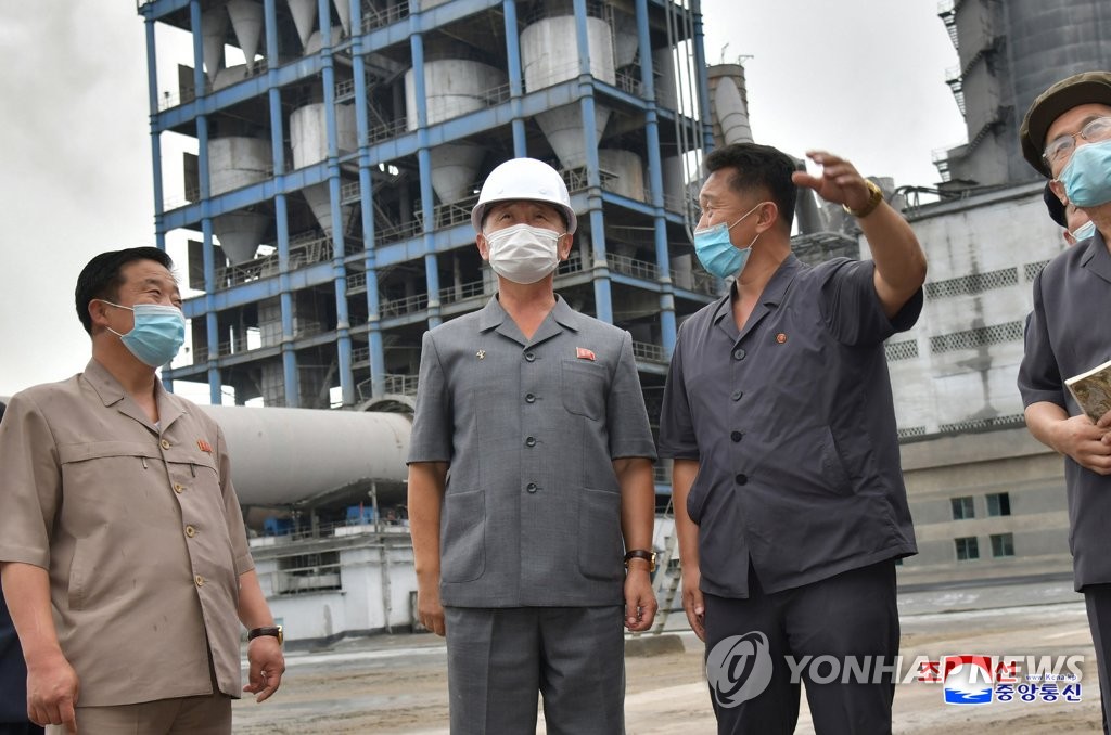 In this file photo, released by North Korea's official Korean Central News Agency on Sept. 7, 2021, Premier Kim Tok-hun (C) inspects a factory. (For Use Only in the Republic of Korea. No Redistribution) (Yonhap)