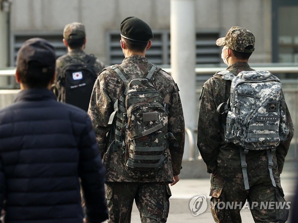 In the Nov. 1, 2021, file photo, soldiers walk outside Seoul Station on the first day of the "living with COVID-19" measures that South Korea has adopted to phase out coronavirus restrictions and reopen the economy amid rising vaccination levels. (Yonhap)