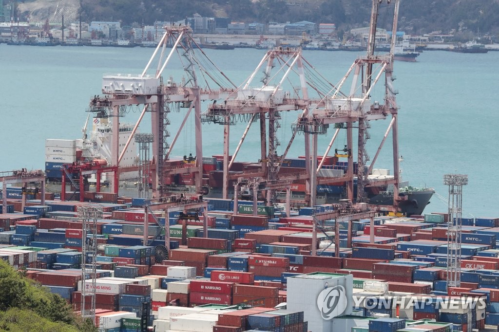 This file photo, taken April 1, 2022, shows stacks of containers at a port in South Korea's southeastern city of Busan. (Yonhap)