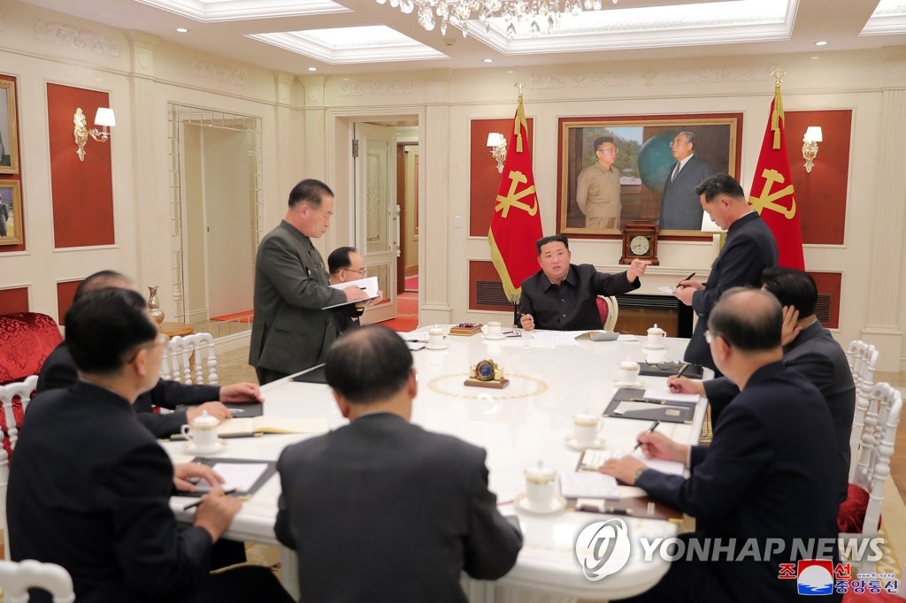 North Korean leader Kim Jong-un (C, rear) presides over a meeting of the Presidium of the Political Bureau of the Central Committee of the Workers' Party at the headquarters of the Central Committee in Pyongyang on May 17, 2022, in this photo released by the North's official Korean Central News Agency. In the meeting to discuss nationwide antivirus measures, Kim urged officials to stabilize the pandemic situation after North Korea reported its first COVID-19 case last week. (For Use Only in the Republic of Korea. No Redistribution) (Yonhap)