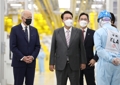 President Yoon Suk-yeol (2nd from L), U.S. President Joe Biden (L) and Samsung Electronics Vice Chairman Lee Jae-yong (3rd from L) tour a Samsung semiconductor plant in Pyeongtaek, 70 kilometers south of Seoul, on May 20, 2022. (Yonhap)