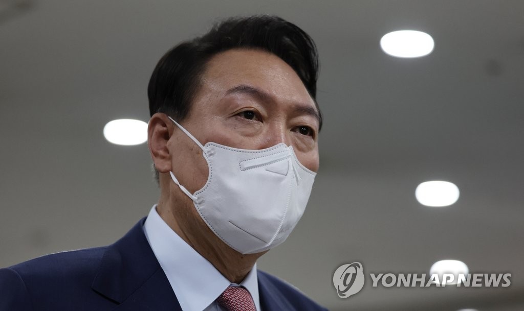 President Yoon Suk-yeol speaks to reporters as he arrives at the presidential office in Seoul on June 9, 2022. (Yonhap)