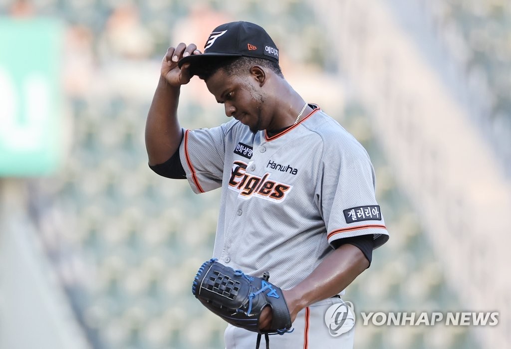 Yefry Ramirez of the Hanwha Eagles adjusts his cap after hitting Yoo Kang-nam of the LG Twins with a pitch during the bottom of the second inning of a Korea Baseball Organization regular season game at Jamsil Baseball Stadium in Seoul on June 21, 2022. (Yonhap)