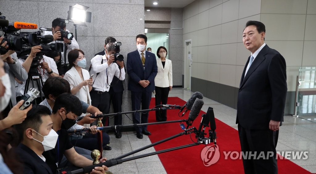 President Yoon Suk-yeol takes reporters' questions at the presidential office in Seoul on July 4, 2022. (Pool photo) (Yonhap)