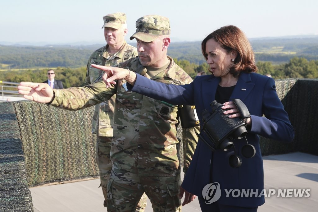 U.S. Vice President Kamala Harris (R) looks at North Korea from Observation Post Ouellette inside the Demilitarized Zone separating Korea at the western section of the inter-Korean border in Paju, north of Seoul, on Sept. 29, 2022. (Pool photo) (Yonhap)