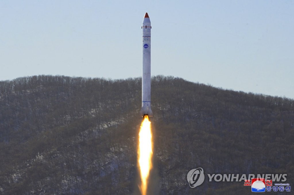 This file photo, carried by North Korea's official Korean Central News Agency on Dec. 19, 2022, shows the North firing a vehicle carrying a "test-piece" satellite at its Tongchang-ri rocket launching facility during a "final-stage" test to develop a military reconnaissance satellite the previous day. (For Use Only in the Republic of Korea. No Redistribution) (Yonhap)