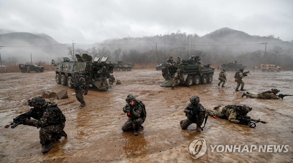 Soldiers from the South Korean Army's TIGER Demonstration Brigade and the Stryker Brigade Combat Team from the U.S. 2nd Infantry Division stage joint drills at the Mugeon-ri training ground in Paju, Gyeonggi Province, on Jan. 13, 2022. (Pool photo) (Yonhap)