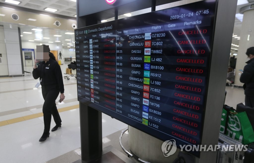 An electronic signboard at Jeju International Airport on the southern Jeju Island shows domestic flights cancelled on Jan. 24, 2023, as a cold wave grips the country. (Yonhap)
