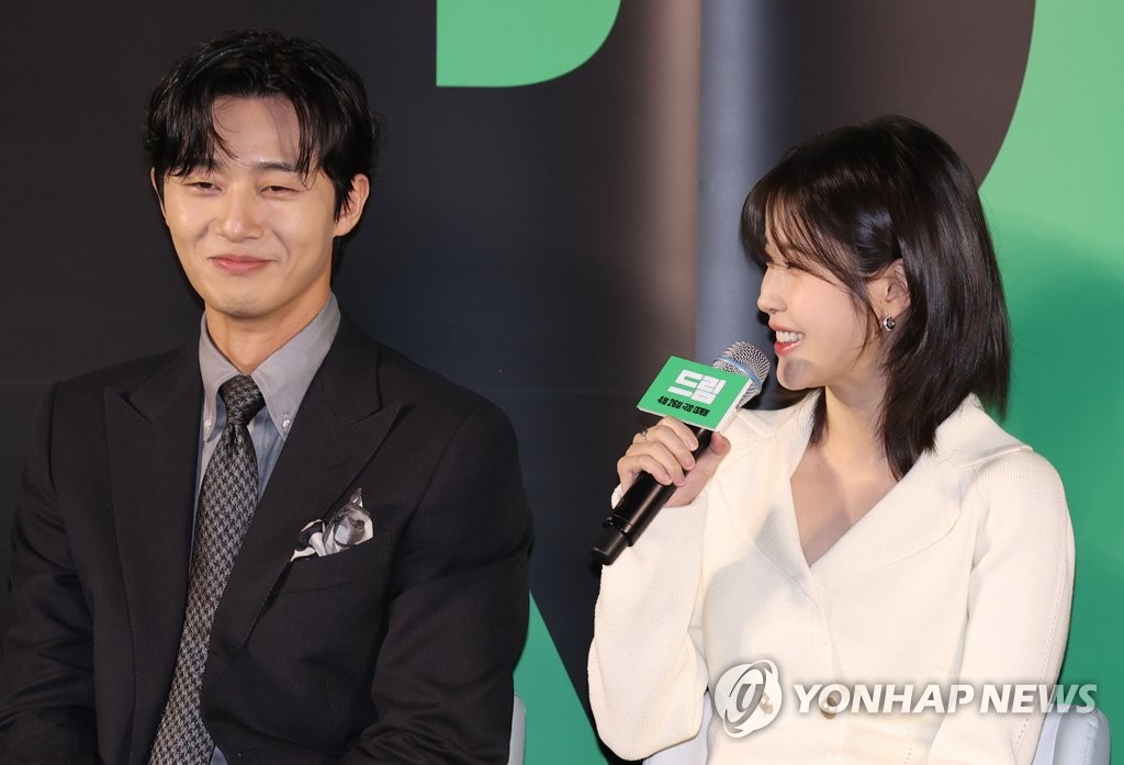 Singer-actor IU (R) and Park Seo-joon speak during a press conference for sports comedy film "Dream" held at multiplex Megabox Seongsu on March 30, 2023. (Yonhap)