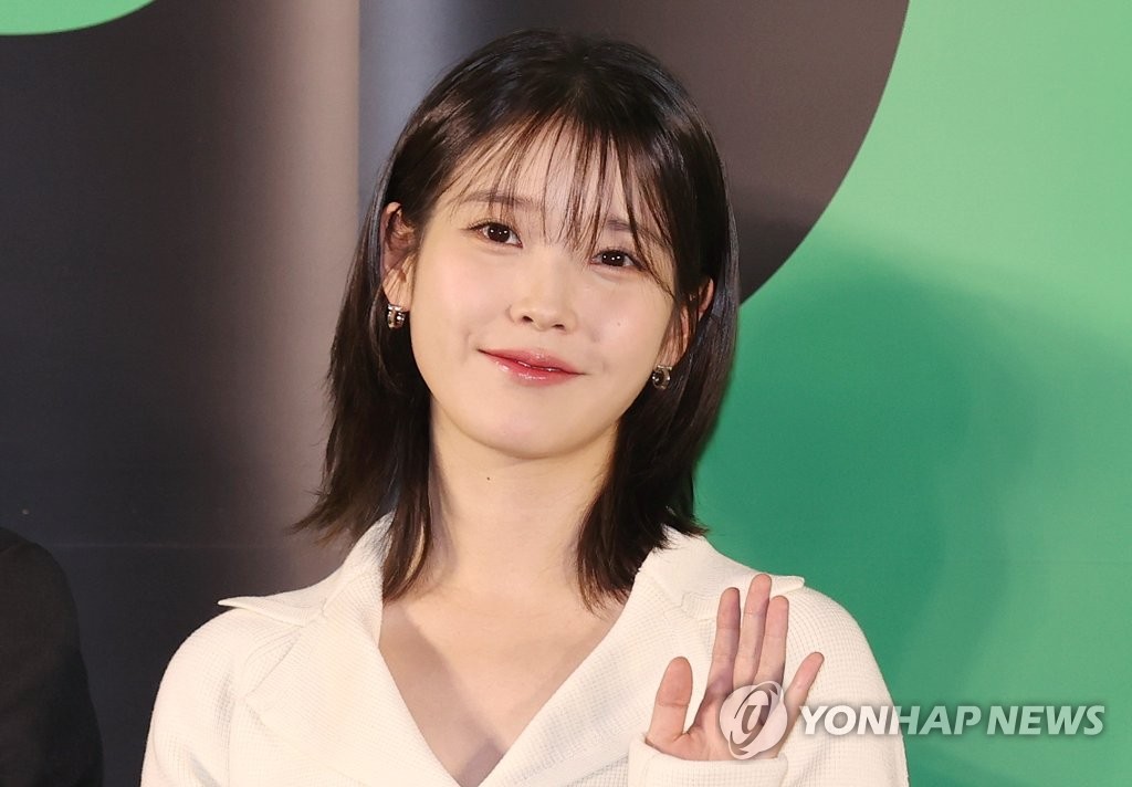 Singer-actor IU poses for a photo during a promotional event for the sports comedy film "Dream" at Megabox COEX on April 17, 2023. (Yonhap)