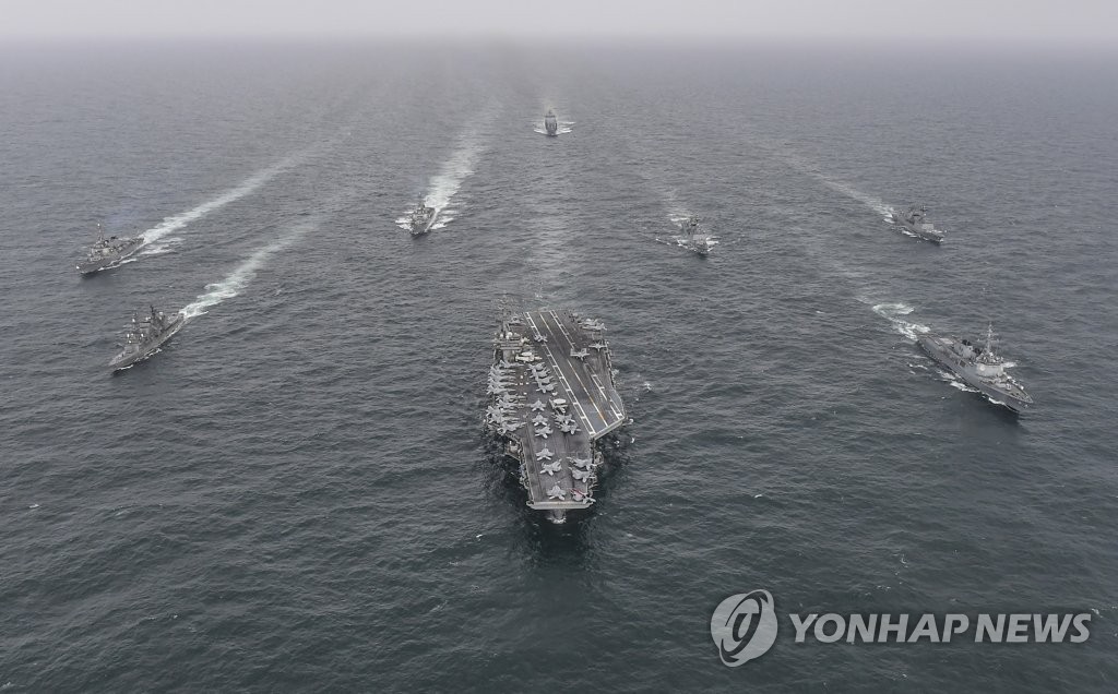 This file photo, released by the South Korean Navy, shows South Korean, U.S. and Japanese warships engaging in a maritime exercise in waters south of the Korean Peninsula on April 4, 2023. (PHOTO NOT FOR SALE) (Yonhap)