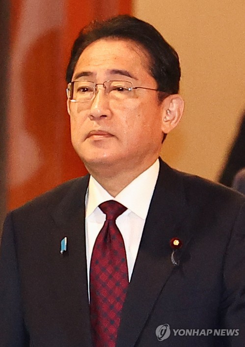 In this file photo, Japanese Prime Minister Fumio Kishida is pictured as he exits a conference with chiefs of major South Korean business associations at a Seoul hotel on May 8, 2023, before returning home following his two-day visit to South Korea. (Yonhap)