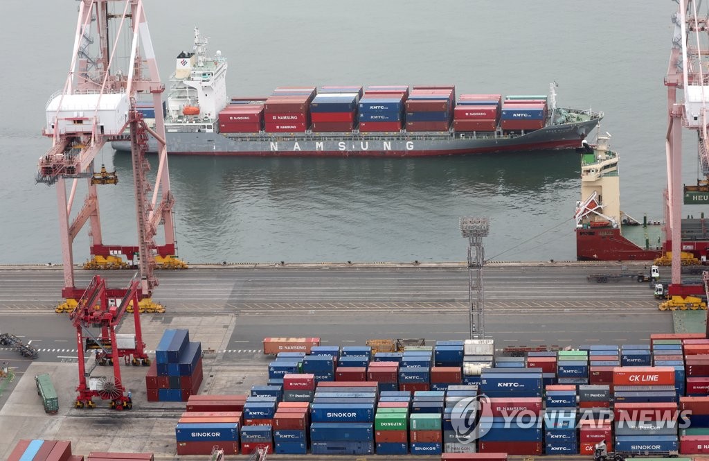 Containers for export are stacked at a pier in South Korea's largest port city of Busan on May 22, 2023. (Yonhap)