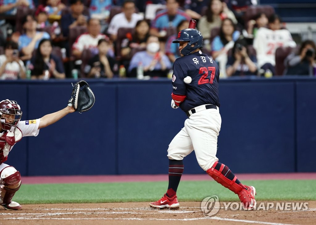 Yoo Kang-nam of the Lotte Giants is hit by a pitch during the top of the second inning of a Korea Baseball Organization regular season game against the Kiwoom Heroes at Gocheok Sky Dome in Seoul on May 28, 2023. (Yonhap)