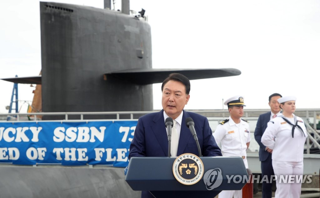 President Yoon Suk Yeol delivers remarks next to the USS Kentucky, a U.S. nuclear-capable ballistic missile submarine, at a naval base in the southeastern port city of Busan on July 19, 2023. (Pool photo) (Yonhap)