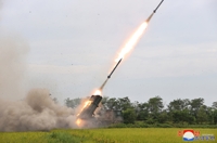 (LEAD) N. Korea fires 10 multiple rocket launcher shells after trilateral air drills
