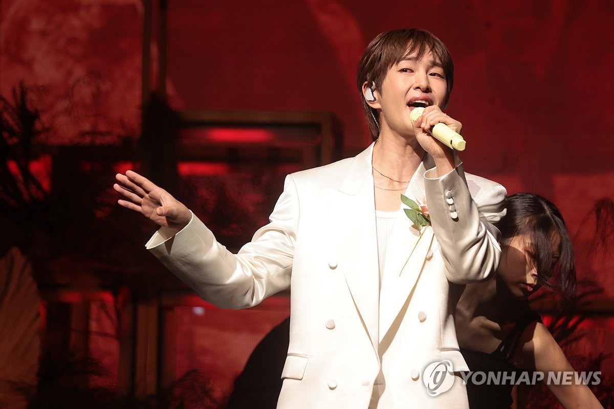 Singer Onew performs